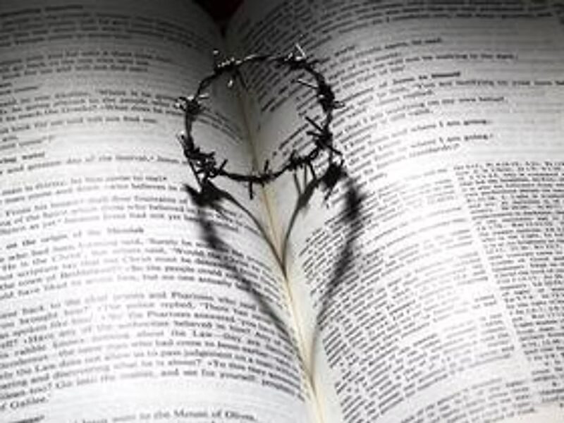 Bible with crown of thorns